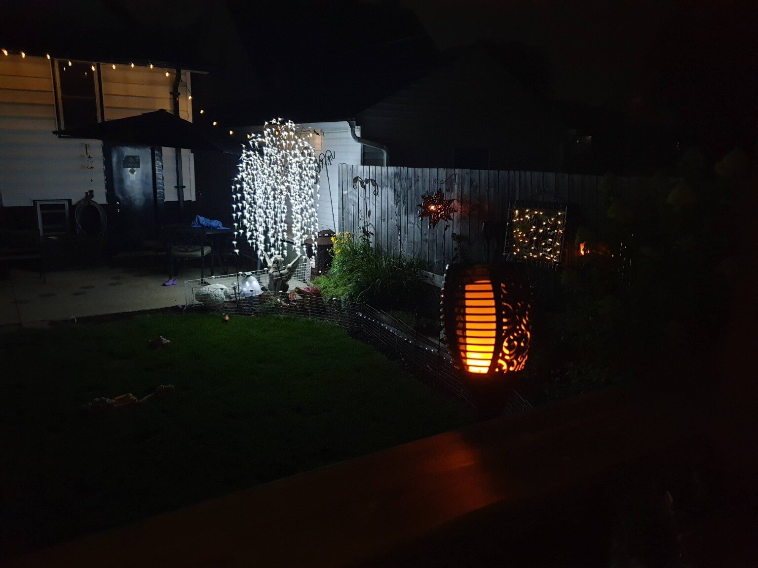 Paul's imaginative garden illuminated at night