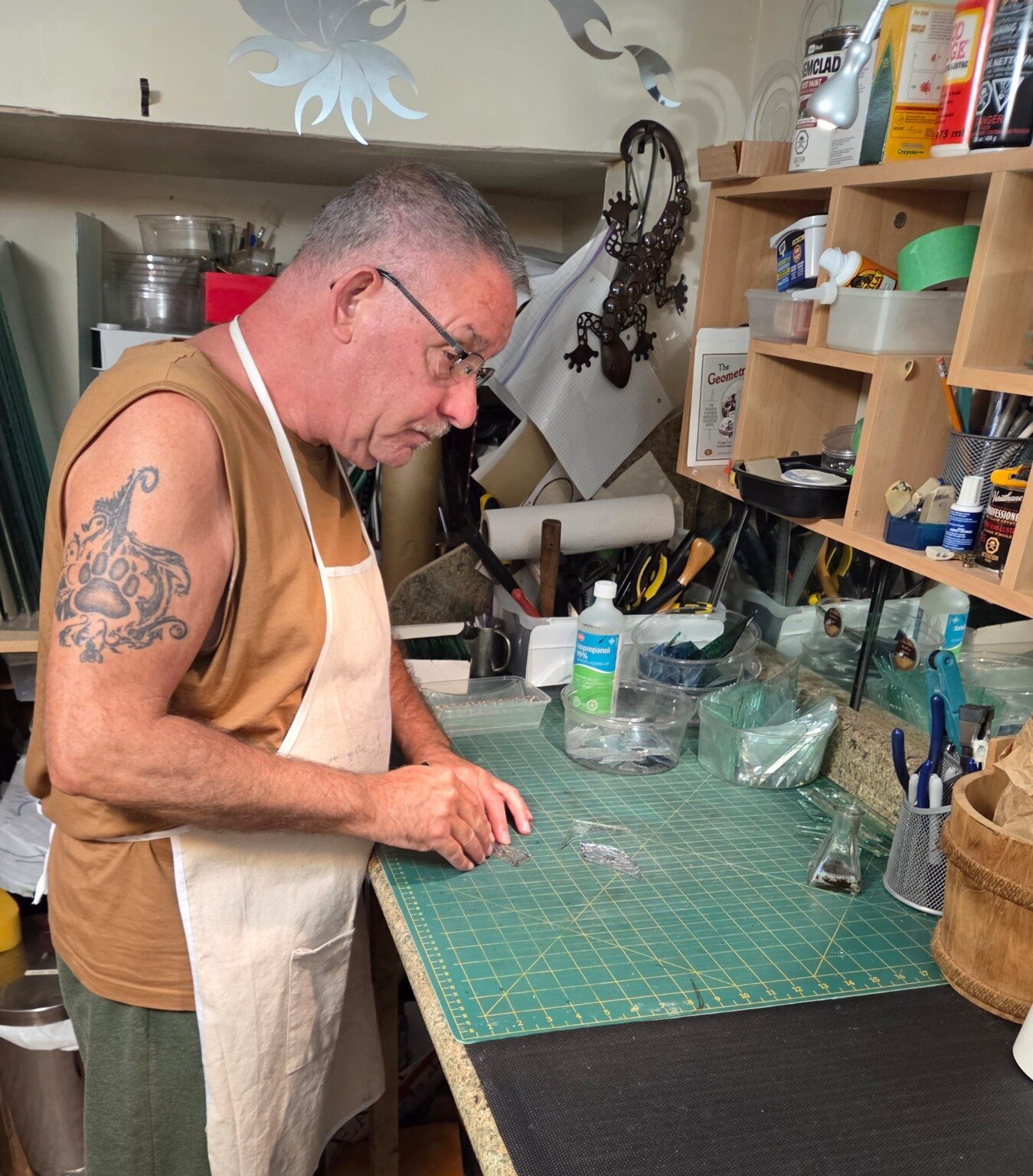 Paul working by hand at his bench in the Bearpaw Studio workshop
