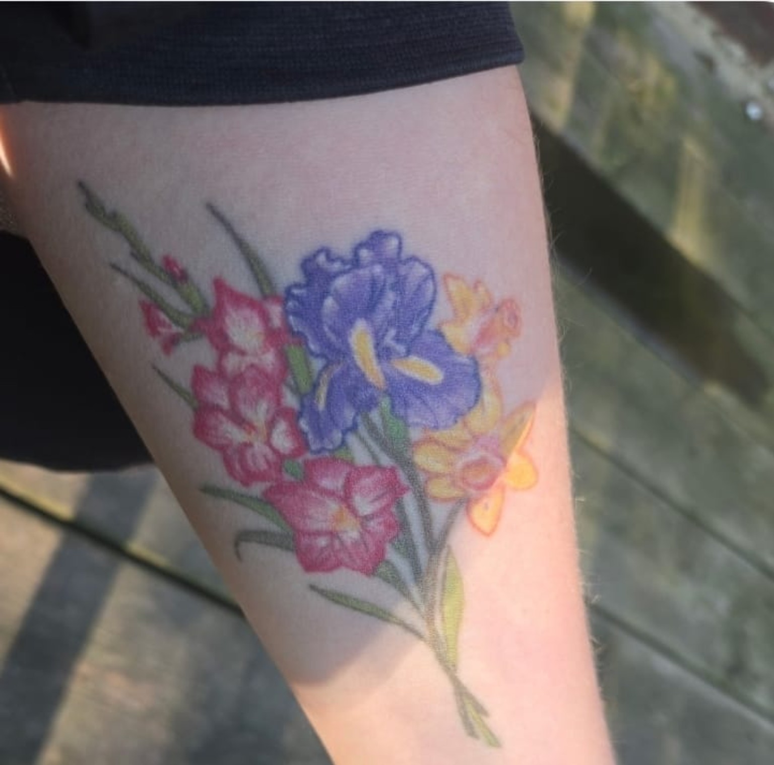 The client's original family flower tattoo